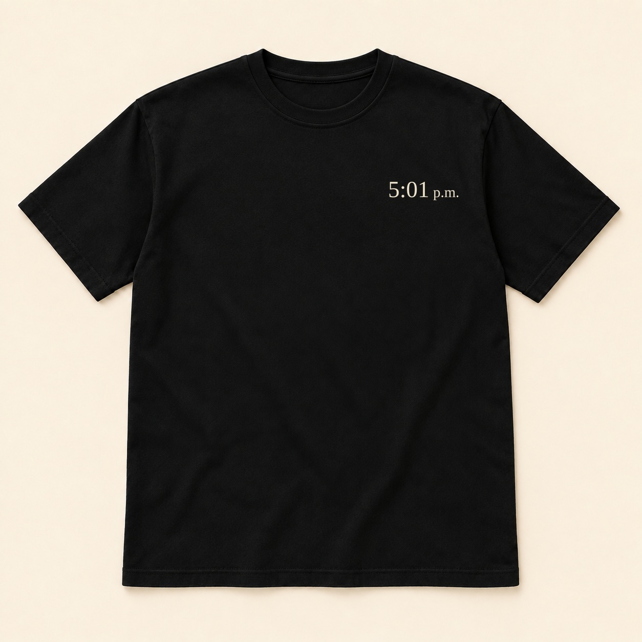 Black tee front design concept with small cream 5:01 p.m. text on the left chest